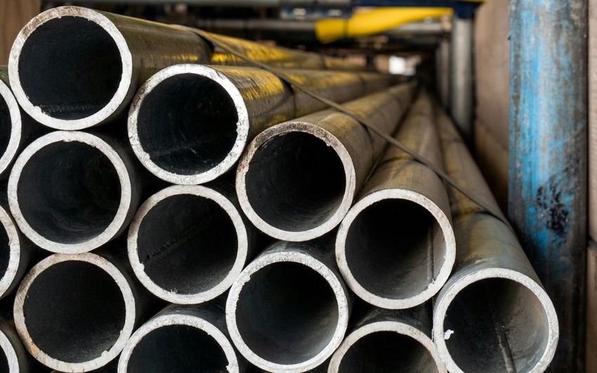 End view of a pile of metal pipes